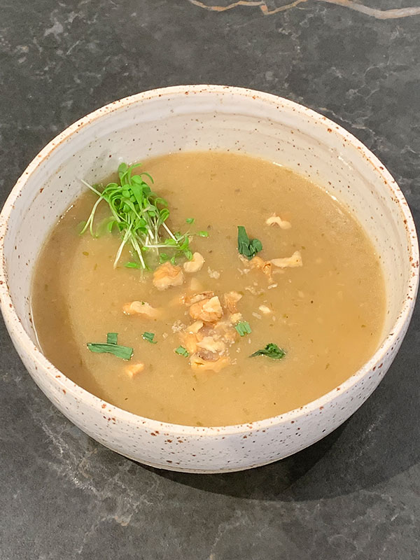 Onion soup with Brussels beer, walnut, cress, fresh tarragon