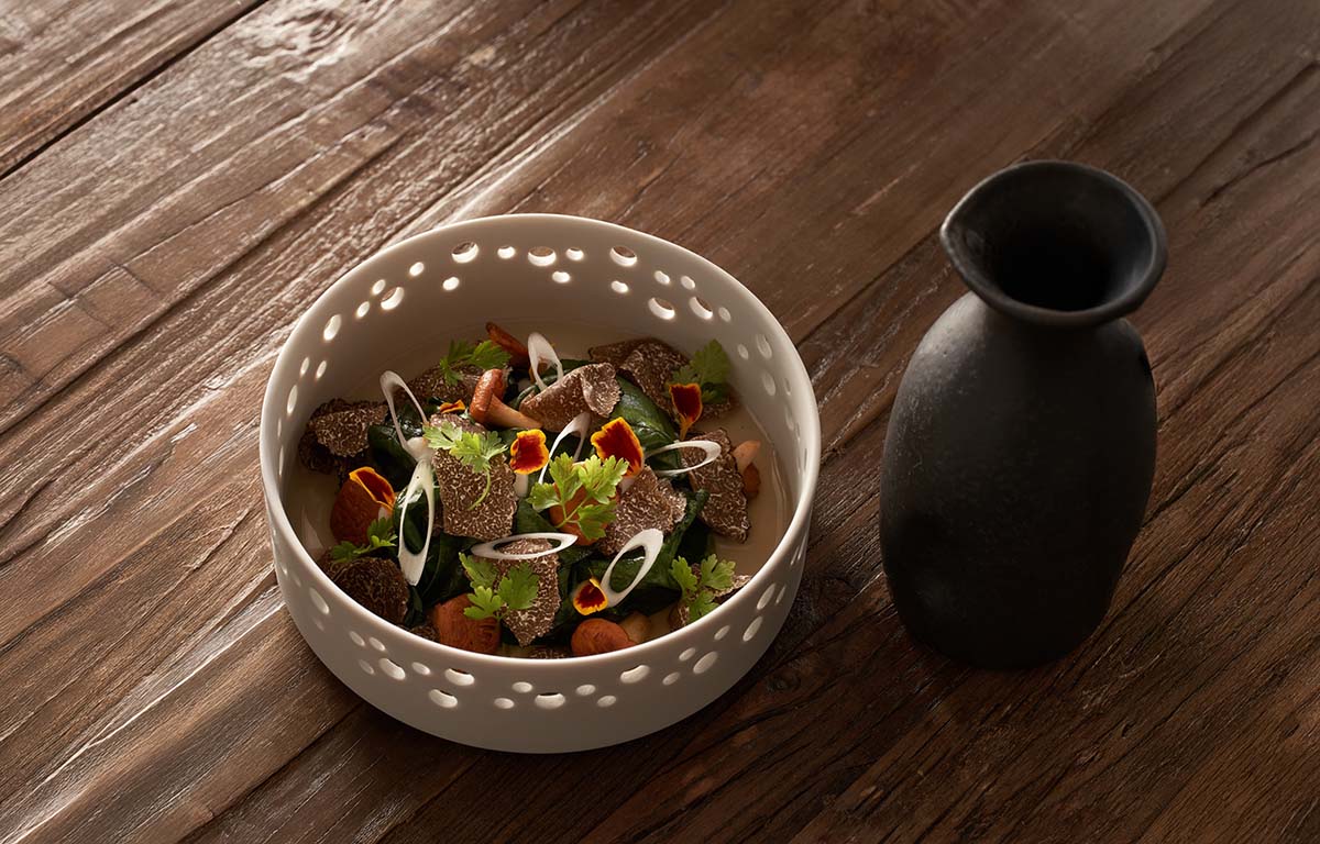Dish with girolles, spinach, sherry oil, autumn truffle and bouillon corsé de champignons.by Mélanie Englebin
