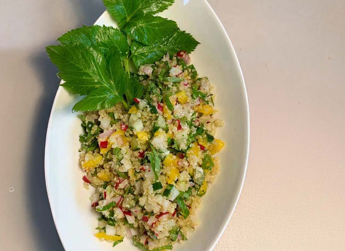 Quinoa salad with fresh vegetables and aromatic herbs