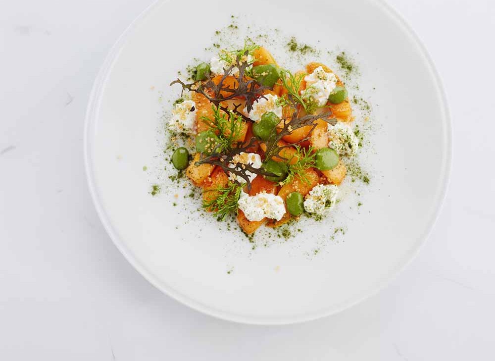 Pan-fried melon with cottage cheese, puffed quinoa, mustard greens and mustard-matcha vinaigrette