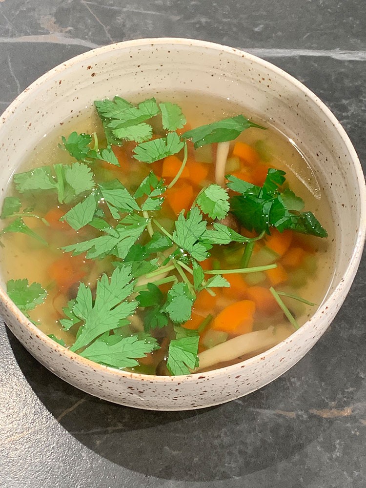 Broth of lemon-leaf-ginger with carrot, coriander, celery