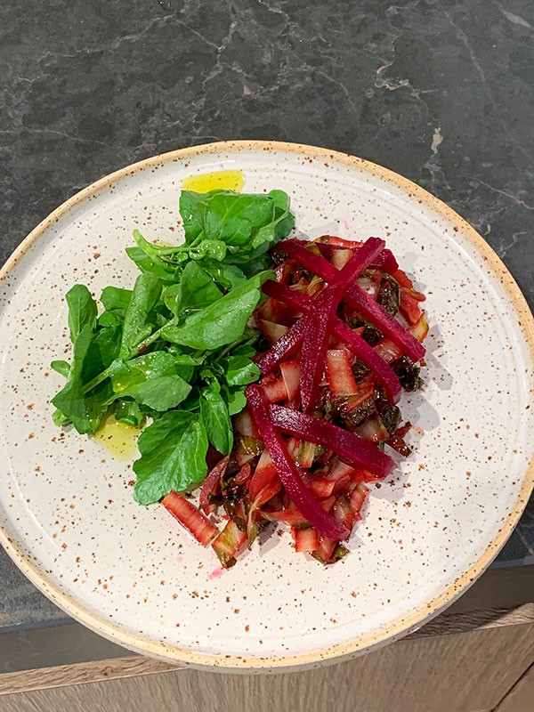 Sliced stewed cardoon, red beetroot juice, salad of watercress