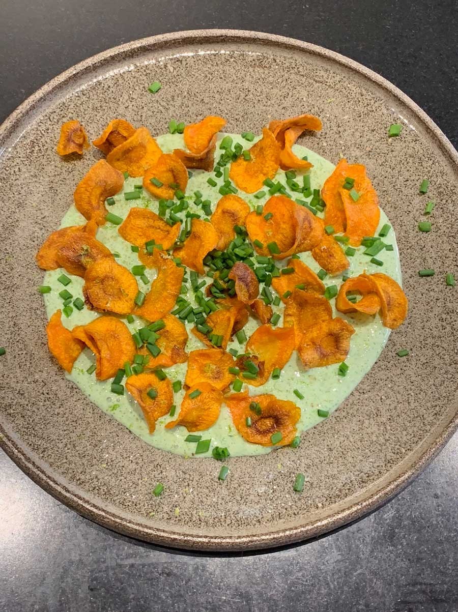 Chips of carrot with green sauce, smoked salt, lime & chives.