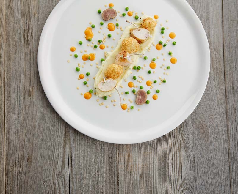 Cauliflower croquettes with paprika drops, pan-fried rabbit cutlet with peas, lemon & rosemary.