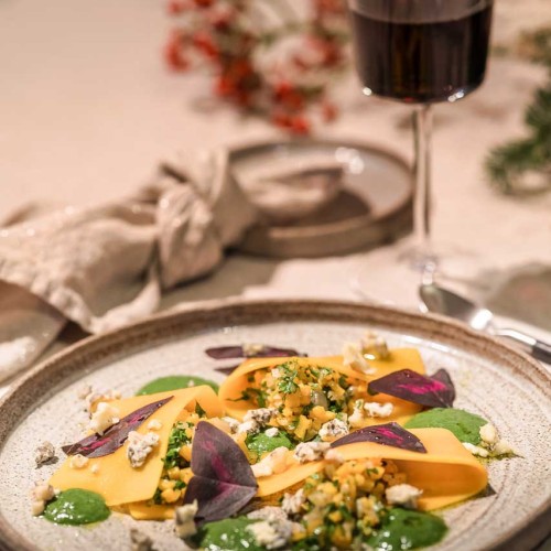 Open pumpkin ravioli with Achelse blue crumble, parsley sauce and Yka leaves.