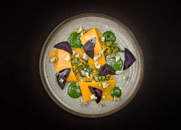 Open pumpkin ravioli with Achelse blue crumble, parsley sauce and Yka leaves